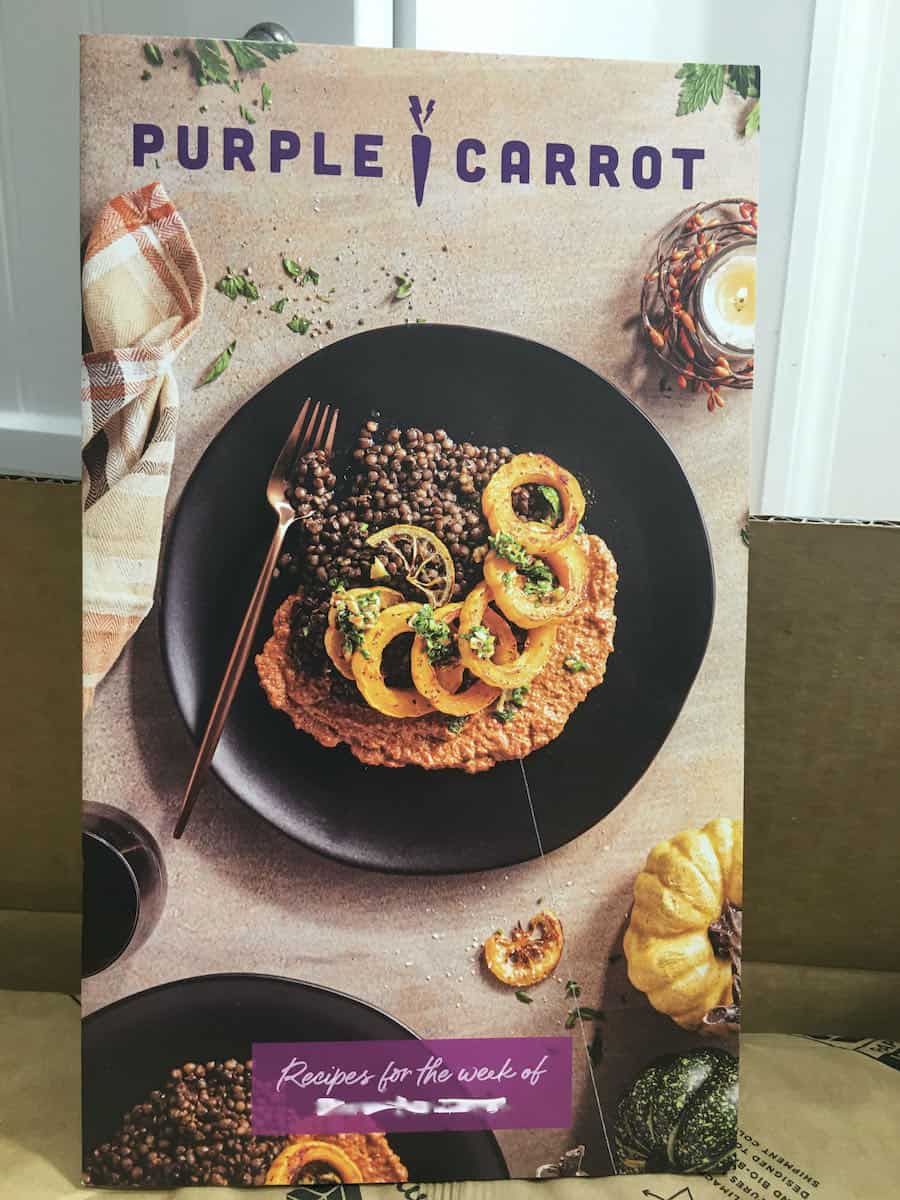 purple carrot menu book standing on counter