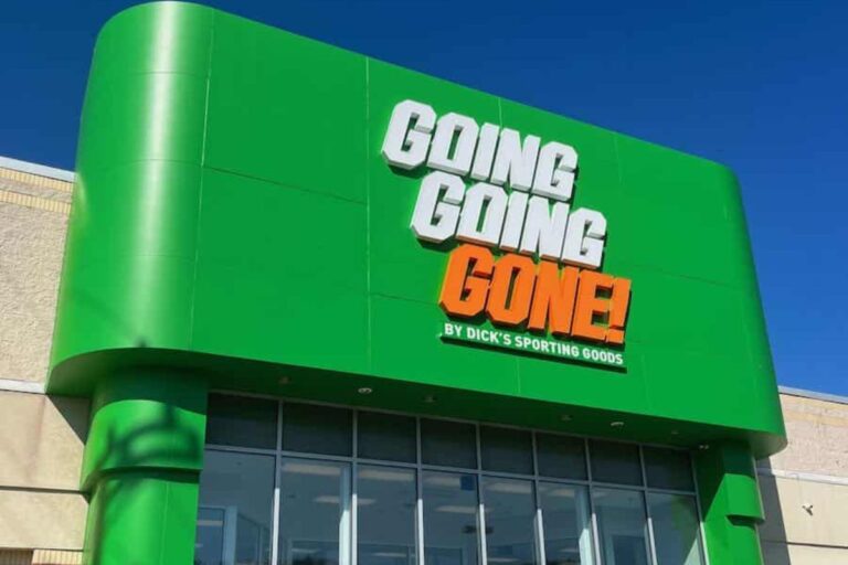 Green, white and orange going going gone store sign.