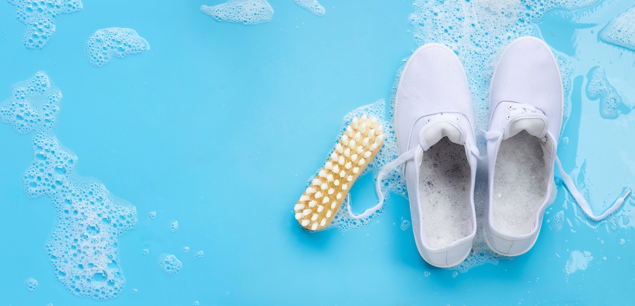 cleaning sneakers on blue background depositphotos