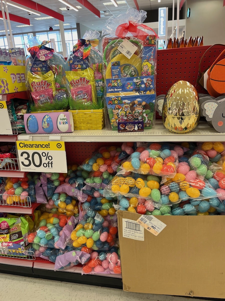 An assortment of easter products on after easter sales, featuring colorful plastic eggs and themed baskets.