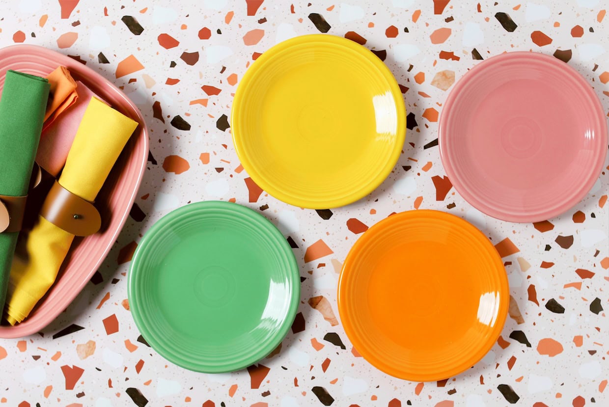Colorful plates and napkins on a table.